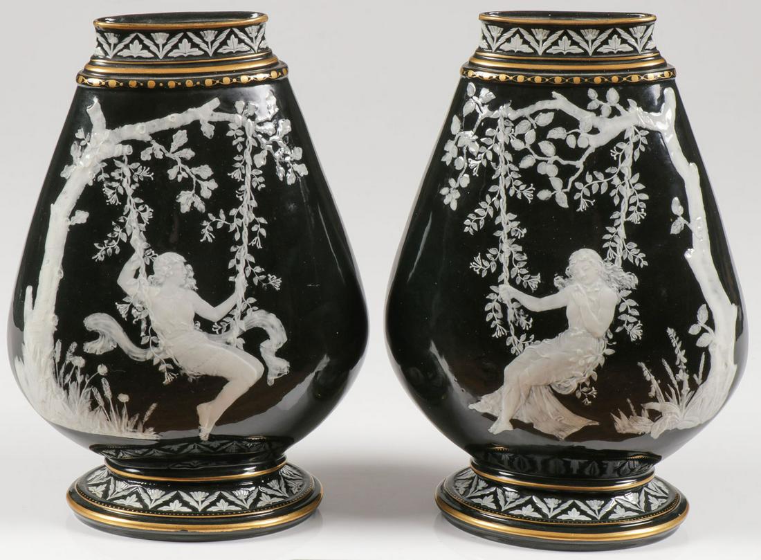 A PAIR OF ENGLISH PÂTE-SUR-PÂTE VASES, C. 1875: A PAIR OF ENGLISH PÂTE-SUR-PÂTE VASES, C. 1875. Comprising an exceptional pair of matching, likely George Jones, compressed ovoid tear drop shaped pillow vases, glazed in dark green and decorated wi
