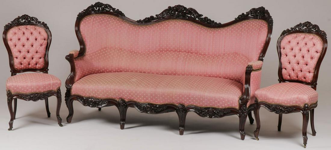 7 PC VICTORIAN CARVED WALNUT PARLOR SET, 19TH C: FINE 7 PC VICTORIAN CARVED WALNUT PARLOR SET, 19TH C. Comprising a settee, four arm chairs, and two side chairs. The sofa triple crested with pierced fruit and floral details above molded serpentine r