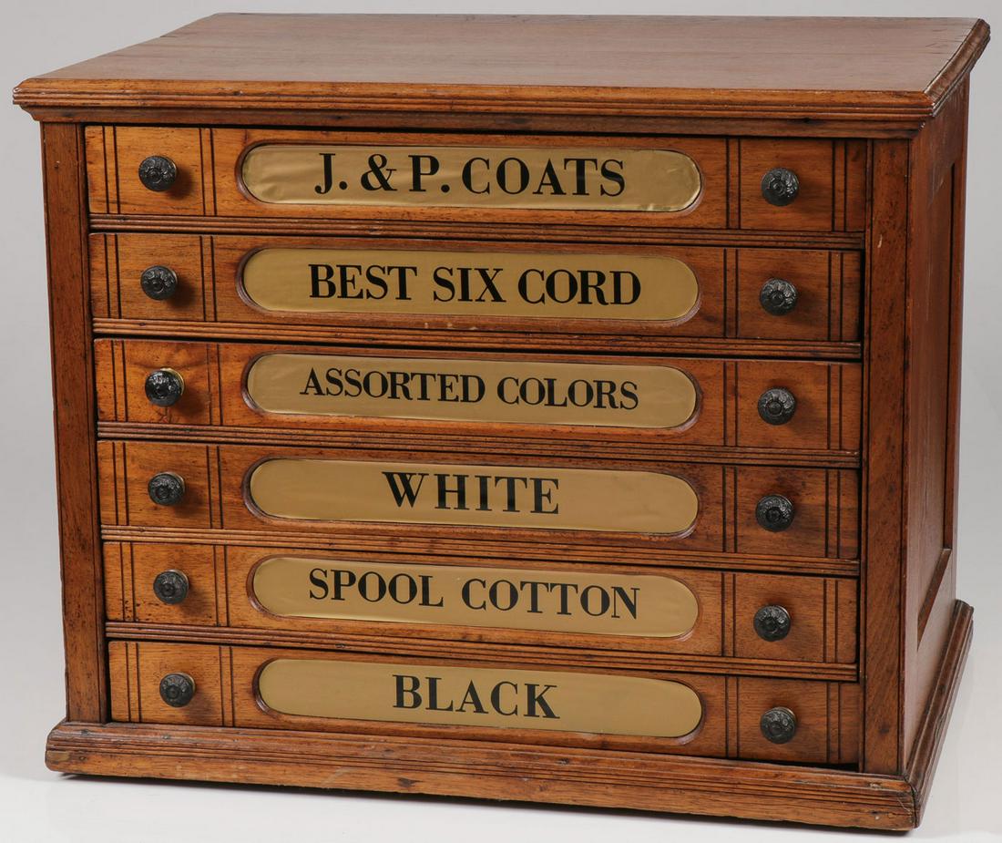 A J & P COATS SPOOL CABINET: A J & P COATS SPOOL CABINET. Of standard six-drawer configuration with matching decorative pulls, and each drawer labeled (possibly later). The verso with J & P Coats gilt stencil. Height 20.5 inches