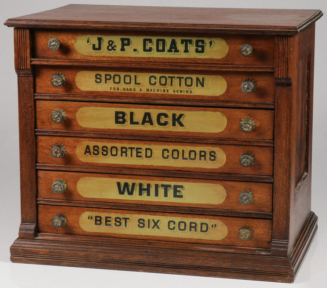 A J & P COATS OAK SPOOL CABINET: A J & P COATS OAK SPOOL CABINET. Of standard six-drawer configuration with matching brass pulls, the verso with later J & P Coats label Height 22 inches width 25.75 inches, and depth 17 inches. SHIPP
