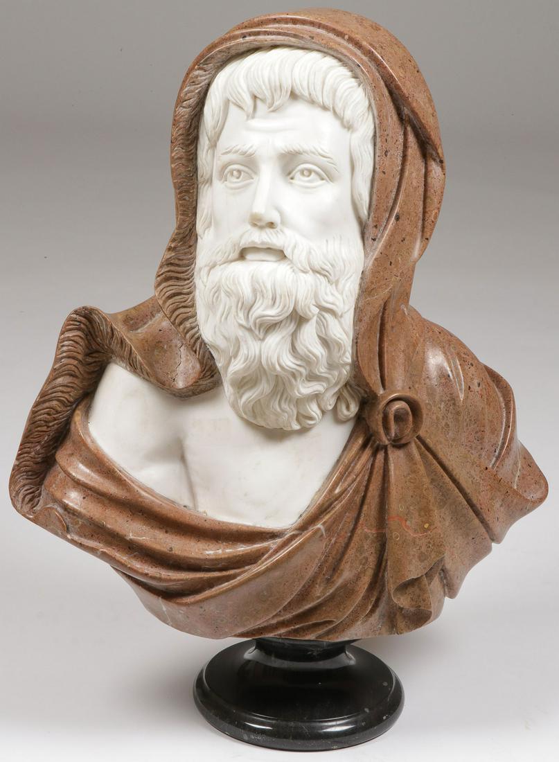 IMPRESSIVE CARVED MARBLE BUST: IMPRESSIVE CARVED MARBLE BUST. Comprising a large and impressive multi-colored carved marble bust of a bearded man with fur-lined cloak resting on a socle base, apparently unsigned, last quarter 20th 