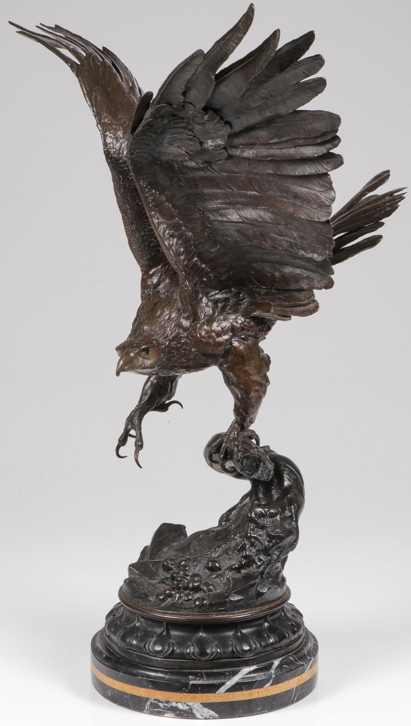 SPECTACULAR FRENCH BRONZE EAGLE, MOIGNIEZ: JULES MOIGNIEZ (French 1835-1894) Eagle Bronze with dark brown patina, resting on a vintage carved marble base banded with leaf tips Signed on base Overall height 30.5 inches (77.5 cm).