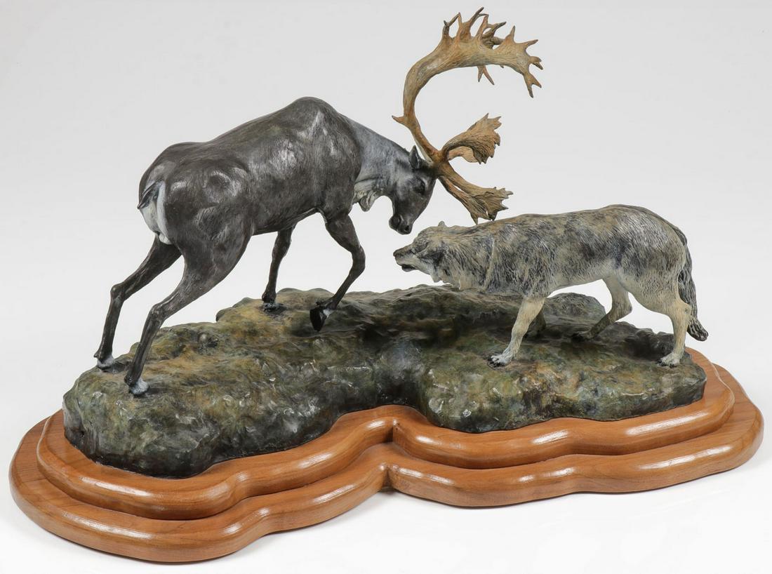 LARGE BRONZE SCULPTURAL GROUPING R. CHRISTENSEN: LARGE BRONZE SCULPTURAL GROUPING R. CHRISTENSEN, 2002. Comprising a large and impressive polychrome bronze figural grouping of a caribou fighting a timber wolf, realistically modeled in full round and
