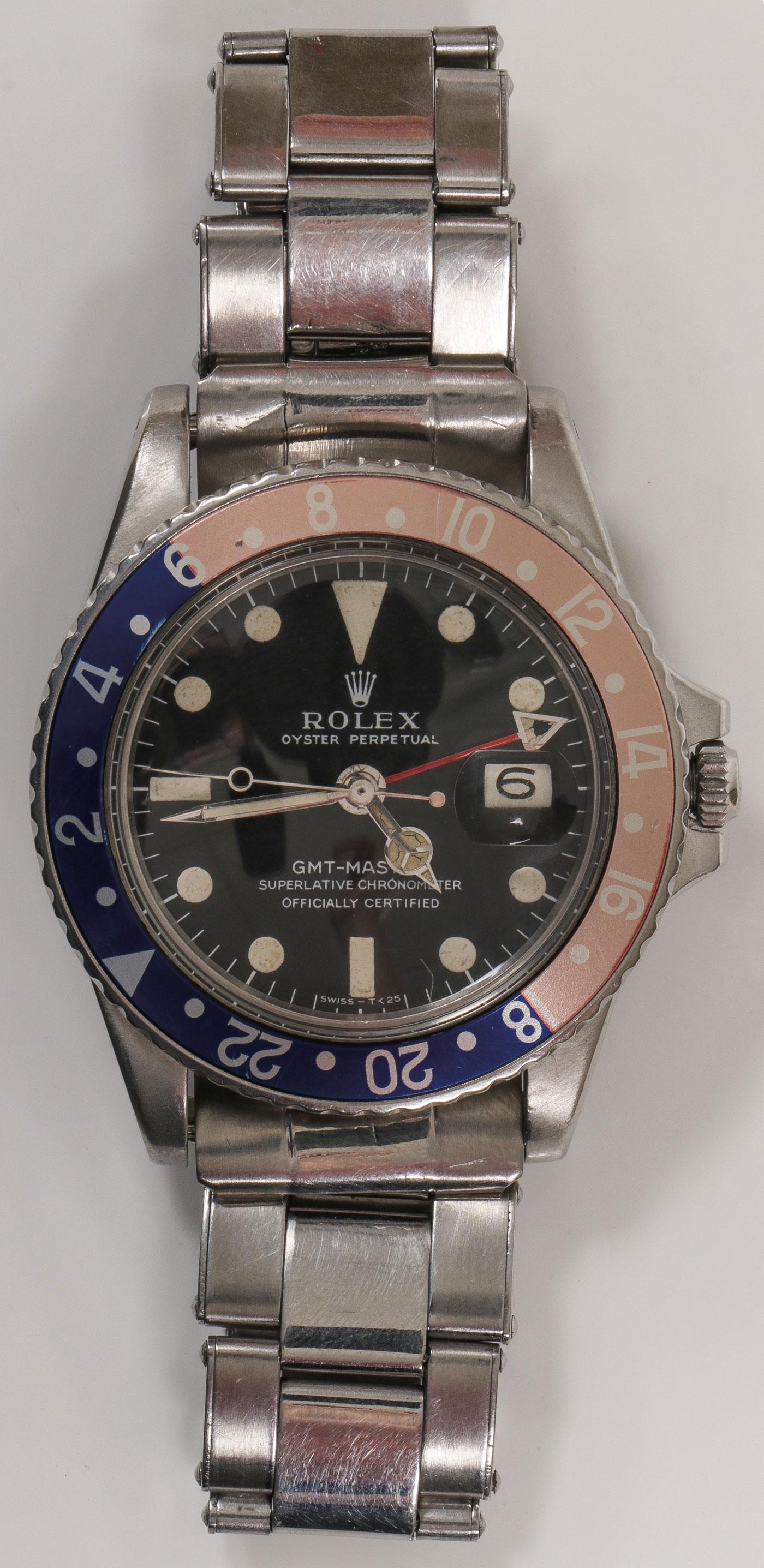 A ROLEX GMT MASTER CHRONOMETER PEPSI 1968.: A ROLEX GMT MASTER CHRONOMETER PEPSI 1968. Comprising a Rolex "Oyster Perpetual GMT Master, superlative Chronometer" with "Pepsi" bidirectional revolving bezel for double time zone, black dial with a