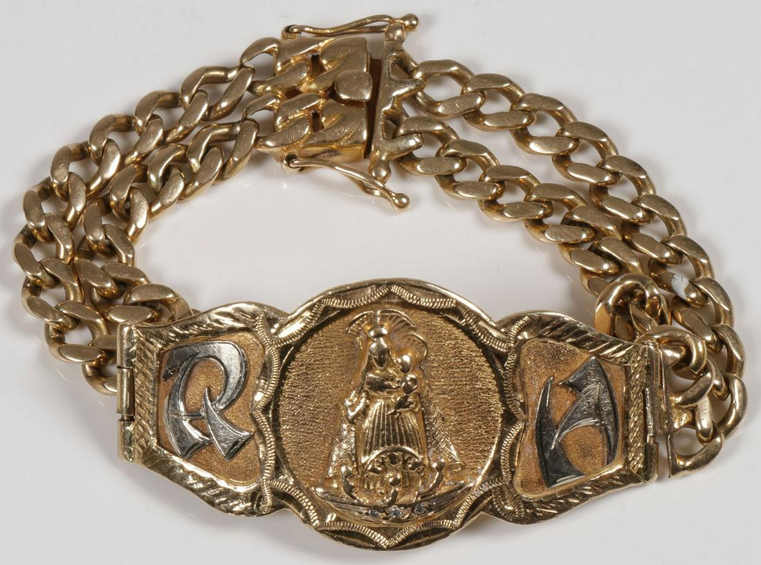HEAVY 14KT GOLD BRACELET: HEAVY 14KT GOLD BRACELET. Comprising a band of two rows of linked 14kt gold chains holding a shaped 14kt gold band centered with a relief medallion of the Virgin and Child and flanked by the initials 