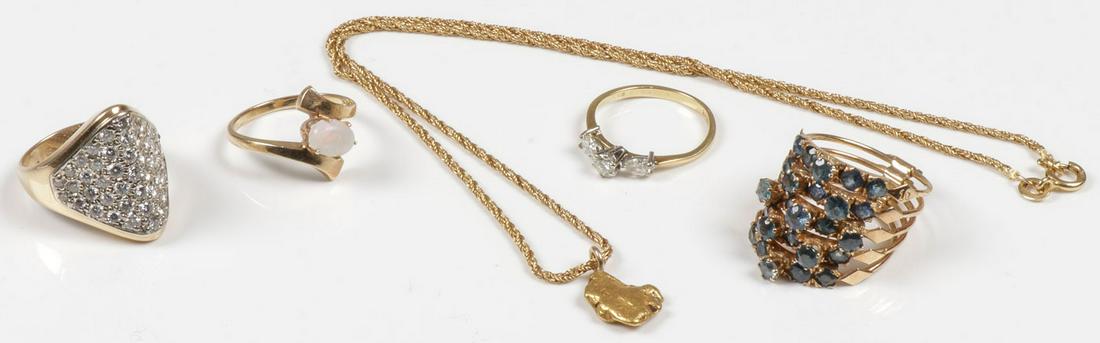 VINTAGE GOLD & DIAMOND JEWELRY: VINTAGE GOLD & DIAMOND JEWELRY. Consisting of four gold rings and a gold nugget necklace. The rings comprised of a 14kt gold opal lady's ring approximate size 6.25, a lady's 14kt gold diamond cluster