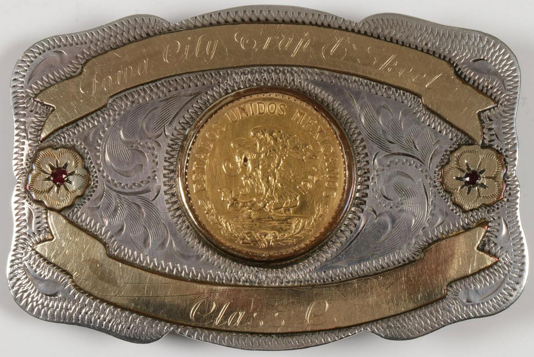 MEXICAN 20 GOLD PESO & SILVER TROPHY BUCKLE: MEXICAN 20 GOLD PESO & SILVER TROPHY BUCKLE. Comprising an engraved silver and garnet set trophy belt buckle by Newman's silver shop, Reno, Nevada. Centered with a 1921 dated Mexican gold 20-peso coin