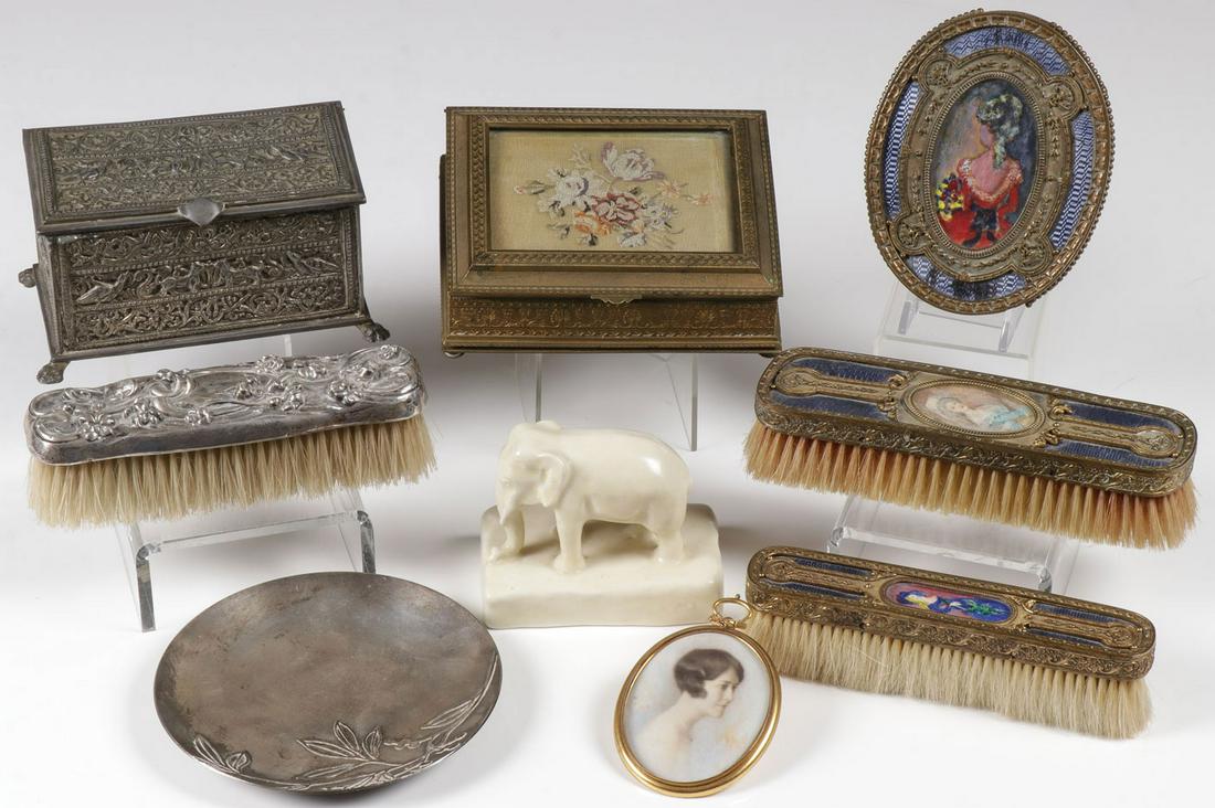 GOOD DECORATIVE ARTS GROUP, C. 1890-1928: GOOD DECORATIVE ARTS GROUP, C. 1890-1928. Comprising nine individual pieces including a three-piece gilt bronze and guilloche enameled partial dresser set including two brushes, an oval hand mirror (m