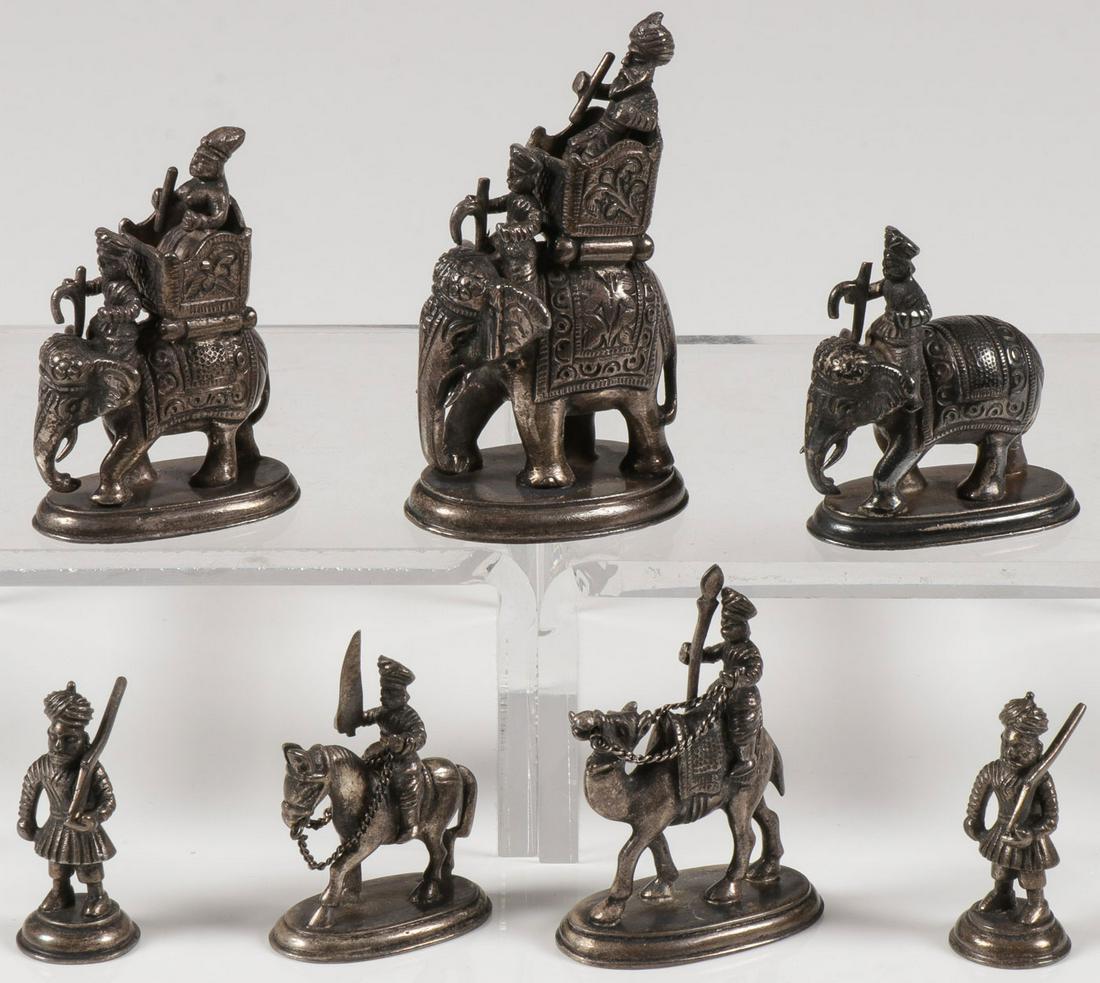CASED SET SILVER FIGURES: CASED SET SILVER FIGURES. Comprising a cased set of seven finely sculpted cast silver figures depicting an elephant procession of an Indian Raja. Each finely sculpted in full round on domed base and s