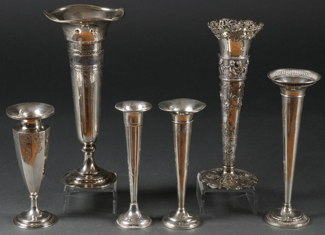 FIVE STERLING TRUMPET VASES: FIVE STERLING TRUMPET VASES. Comprising six individual sterling silver trumpet form vases of various sizes and makers, three with weighted bases, and including a large example with pierced banding, en