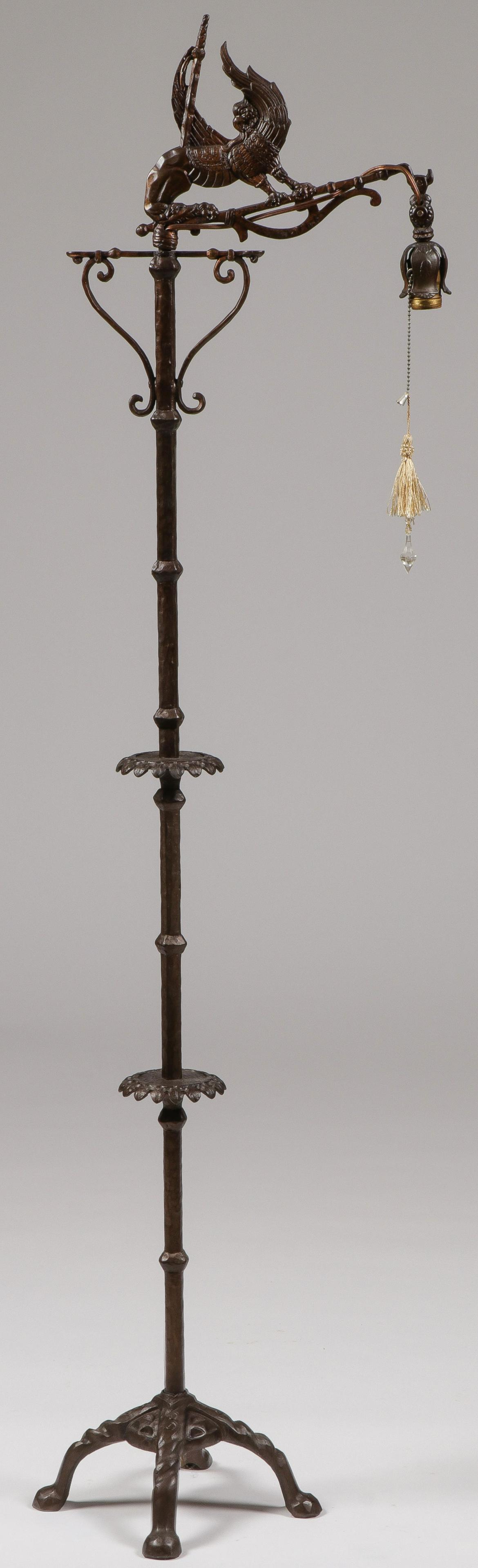 GREAT GOTHIC STYLE CAST-IRON FLOOR LAMP: GREAT GOTHIC STYLE CAST-IRON FLOOR LAMP. Comprising a wonderfully decorative iron floor lamp resting on four raised feet with hammered column and interspaced with decorative discs, the light arm confi