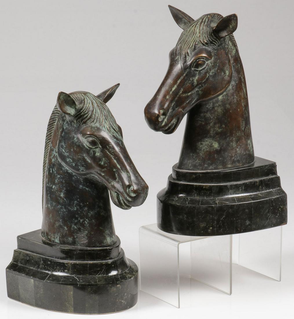 MAITLAND-SMITH BRONZE BOOK ENDS: MAITLAND-SMITH BRONZE BOOK ENDS. Comprising a pair of matching bronze horse head bookends resting on laminated stepped bases, underside with Maitland-Smith label. Overall height of each 12.5 inches.