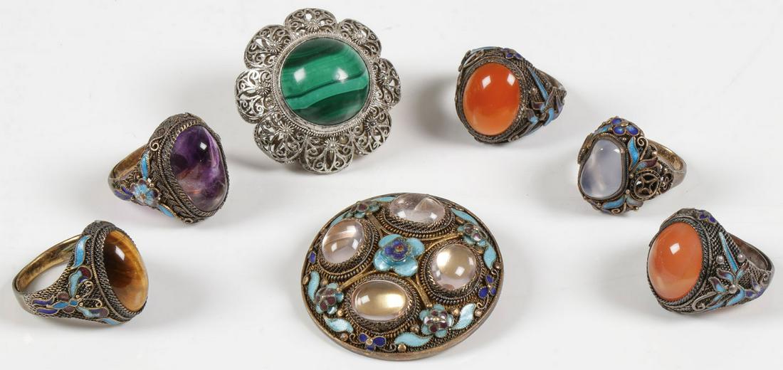 CHINESE STERLING & HARDSTONE JEWELRY: CHINESE STERLING & HARDSTONE JEWELRY. Comprising five sterling filigree and enameled rings, each set with polished stone including amethyst and tiger eye. Together with two silver filigree brooches, o