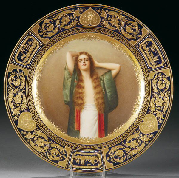 ROYAL VIENNA PLATE BIEN ETRE NONNENBRUCH: A ROYAL VIENNA STYLE PORTRAIT PLATE "BIEN ETRE" circa 1900 of an exotic beauty after the painting by Max Nonnenbruch (German 1857-1922). Within a cobalt rim with fine gilt scrolling, marked on verso w