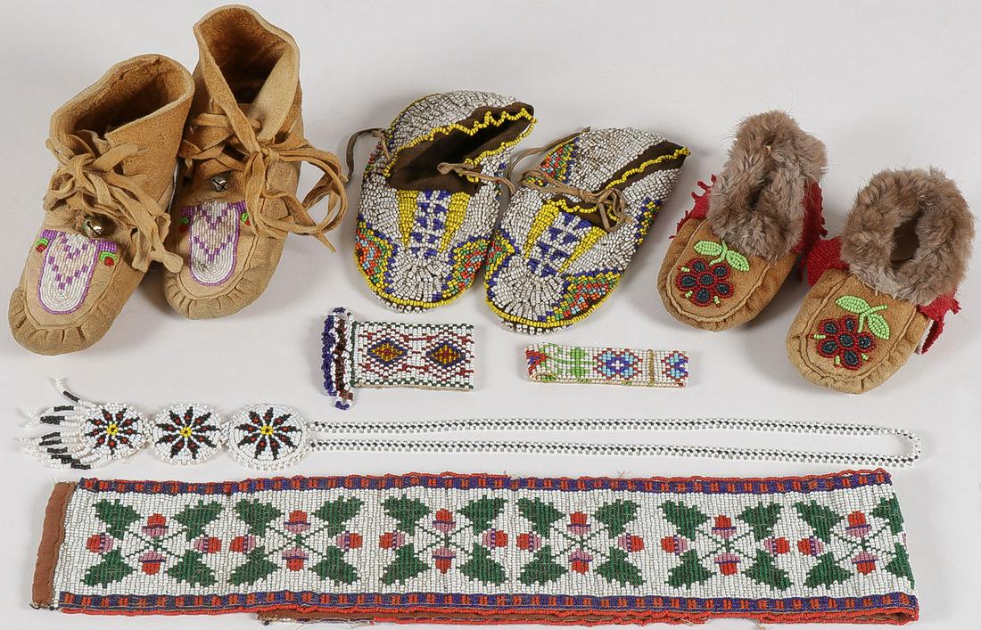 BEADED MOCCASIN GROUP & MORE: BEADED MOCCASIN GROUP & MORE. Comprising three pair of beaded children's moccasins, the best pair pictured at center with lazy stitched sides and soles on a tanned hide body, length 6.5 inches, and wi