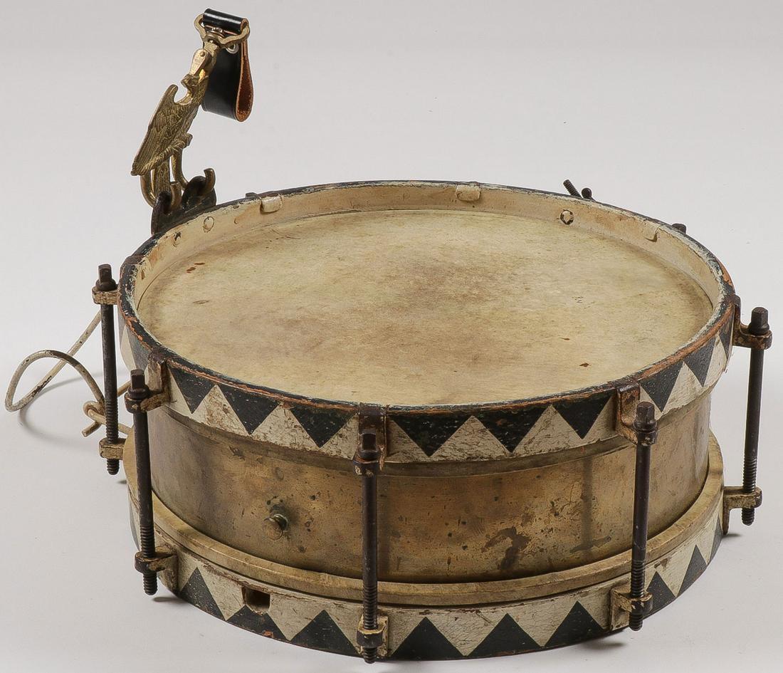 A GERMAN WWII MARCHING SNARE DRUM: A GERMAN WWII MARCHING SNARE DRUM. Comprising a complete German WWII period marching snare drum, brass shell body with wooden upper and lower rims painted with black and white saw tooth pattern, eight