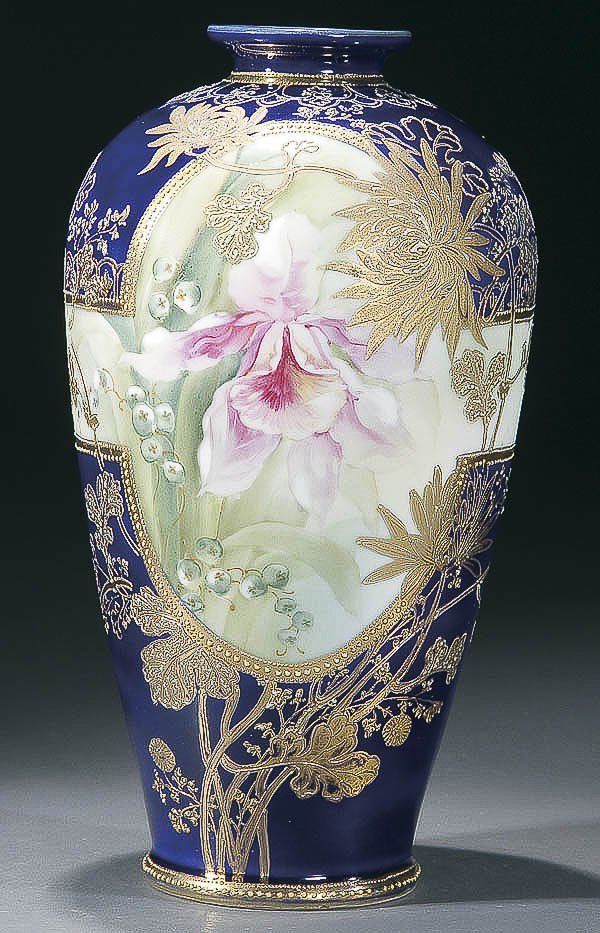 A VERY FINE NIPPON COBALT PORCELAIN VASE early 20: A VERY FINE NIPPON COBALT PORCELAIN VASE early 20th century, with hand painted iris overlaid with raised gilt chrysanthemum blossoms against a cobalt ground with scrolling gilt florals. Height 11.5 in