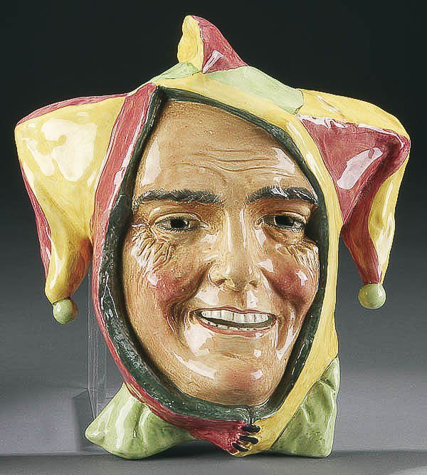 A ROYAL DOULTON "JESTER" FACE MASK circa 1937 wit: A ROYAL DOULTON "JESTER" FACE MASK circa 1937 with molded porcelain and glazed finish, 11 inches, inscribed and marked on base. Estimate $200-$400