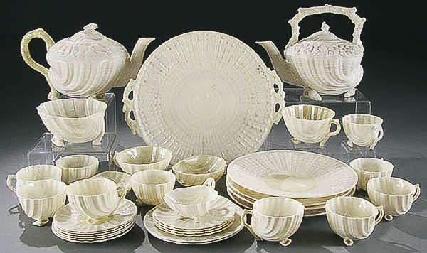 IRISH BELLEEK NEPTUNE PORCELAIN TEA SERVICE 1965-: IRISH BELLEEK NEPTUNE PORCELAIN TEA SERVICE 1965-1981, third green mark 34 pieces. Comprised of two teapots, cake plate, four 8-inch plates, 2 coffee cups & saucers, 10 tea cups & saucers, 3 sugar bow
