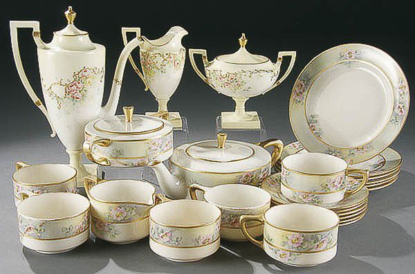 LENOX & CERAMIC ART BELLEEK TEA & CHOCOLATE SETS: A LENOX & CERAMIC ART AMERICAN BELLEEK TEA SET & CHOCOLATE SET circa 1900, consisting of a 3-piece C.A.C. floral decorated chocolate set and a 21-piece Lenox tea set, service for 6 with dessert plates