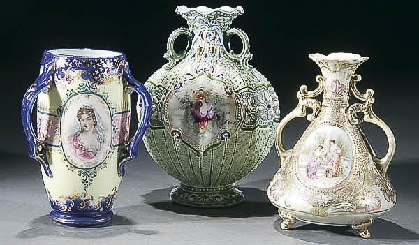 A GROUP OF THREE NIPPON HANDLED VASES 20th centur: A GROUP OF THREE NIPPON HANDLED VASES 20th century comprised of a three-handled cobalt blue floral vase, a raised and jeweled three-handled vase, together with a two-handled footed floral decorated va