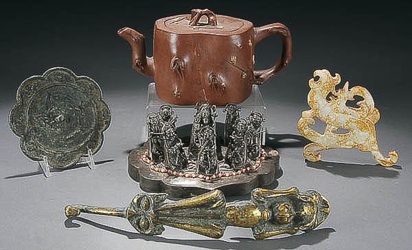 ANCIENT CHINESE BRONZE MIRROR & BELT BUCKLE RELIC: ANCIENT CHINESE BRONZE MIRROR & BELT BUCKLE RELICS together with a 20th century redware tea pot, a group of silvered Lohan figures and a carved hardstone dragon. Largest 9.5 inches. Estimate $100-$200