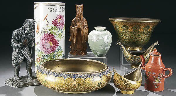 A 9-PIECE ORIENTAL DECORATIVE ARTS LOT early to m: A 9-PIECE ORIENTAL DECORATIVE ARTS LOT early to mid 20th century, including an enameled porcelain brush jar, leadware figure, porcelain tea kettle, carved wooden elder, an Indo-Persian lacquered conso