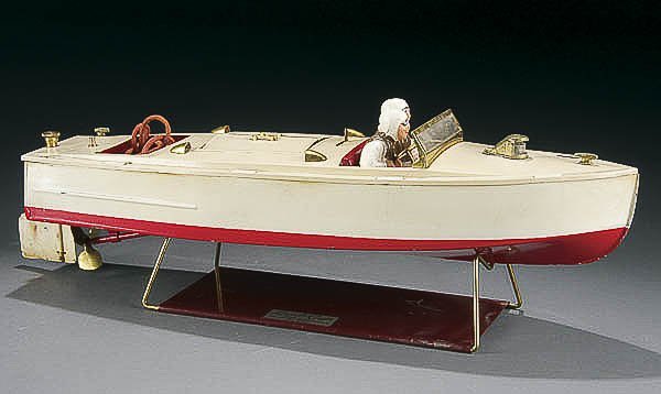 A LIONEL CRAFT KEYWIND SPEED BOAT circa 1935, tin: A LIONEL CRAFT KEYWIND SPEED BOAT circa 1935, tin with spring wound motor and compo figures on original display stand. Nice paint, flag absent. Length 17 inches. Estimate $300-$500
