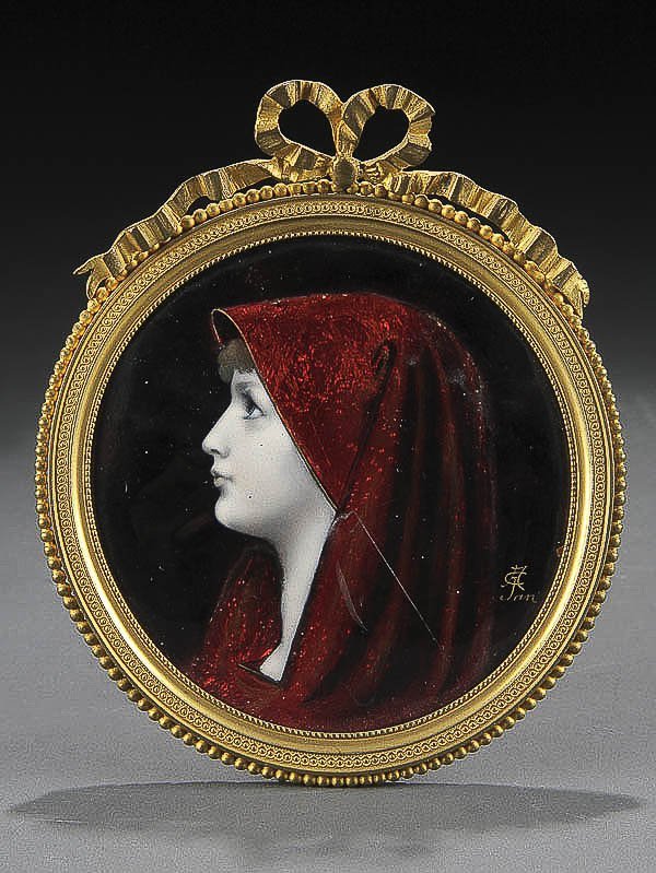 LIMOGES ENAMELED & GILT BRONZE FRAMED PLAQUE circ: LIMOGES ENAMELED & GILT BRONZE FRAMED PLAQUE circa 1900, of a woman in red hood, inscribed in gilt 'AC Jan'. H.5.5 inches. Estimate $75-$150