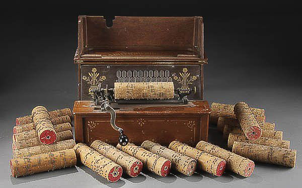 A VICTORIAN MUSICAL CYLINDER COBB ORGAN in walnut: A VICTORIAN MUSICAL CYLINDER COBB ORGAN in walnut case, with 21 songs. Estimate $150-$250
