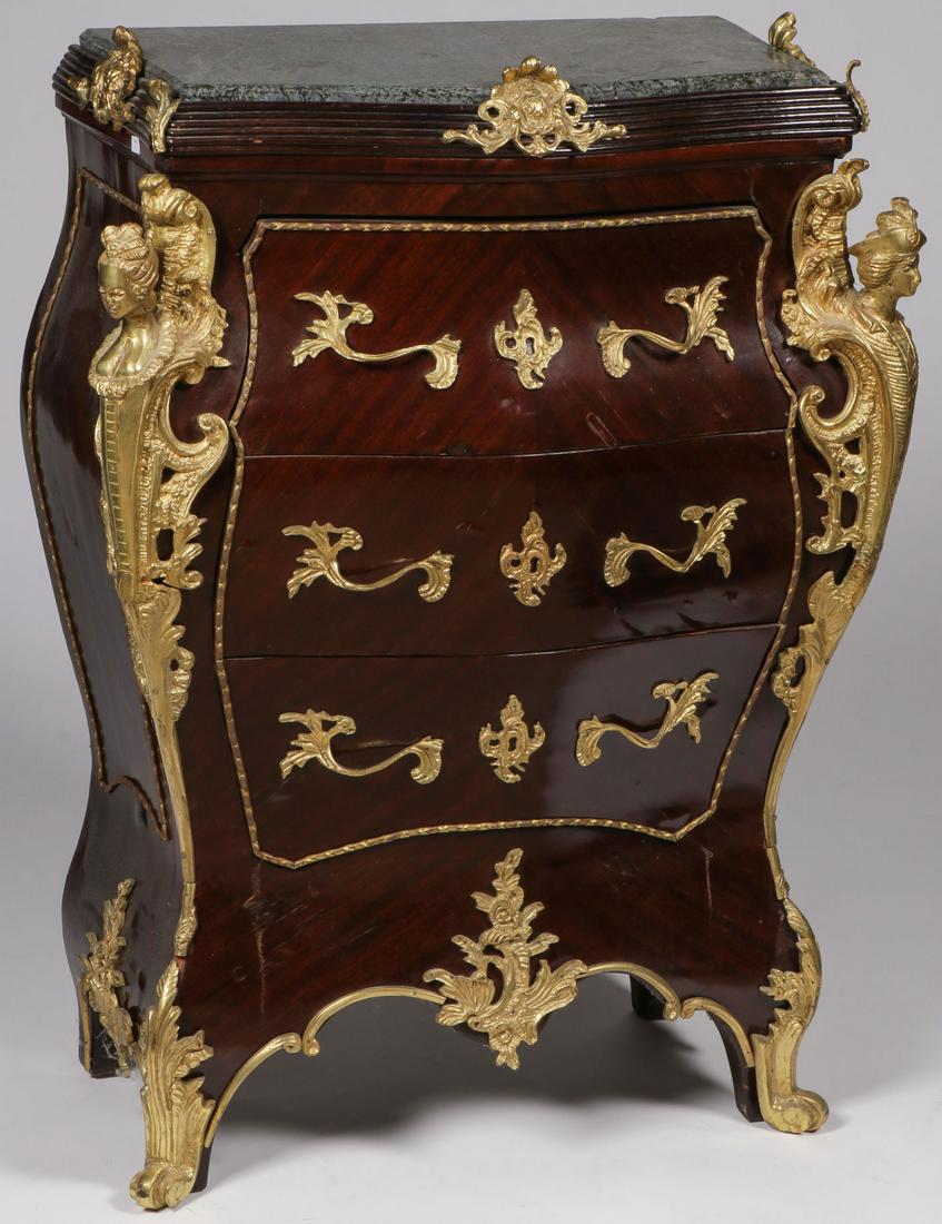 ORNATE BOMBAY CHEST: ORNATE BOMBAY CHEST. Comprising a French style ormolu mounted Bombay chest with three drawers and figural corners. Height 36.75 inches, width 27.25 inches, depth 14.5 inches. SHIPPING NOTICE:<