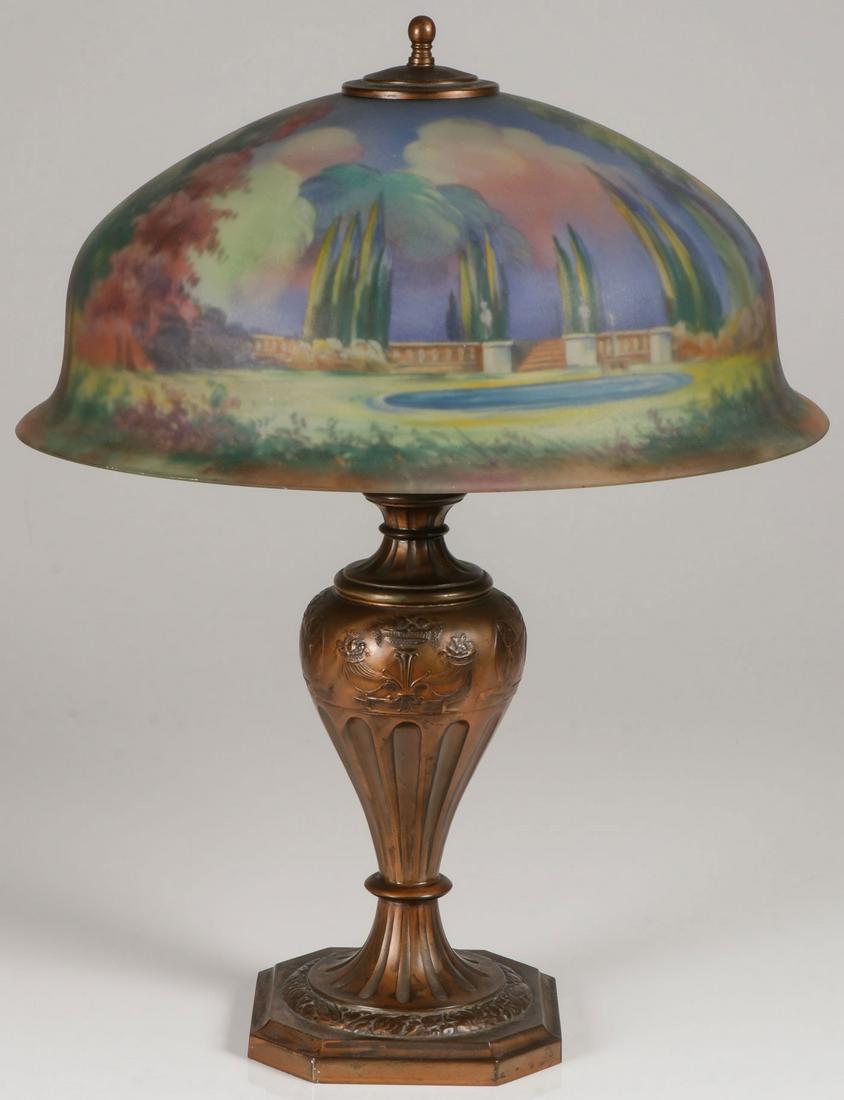 PAIRPOINT REVERSE PAINTED LAMP, SIGNED: PAIRPOINT REVERSE PAINTED LAMP, SIGNED. The attractive bronzed metal base of baluster form, banded with cornucopia and anthropomorphic figures and with fluted stem supporting a three socket fixture up