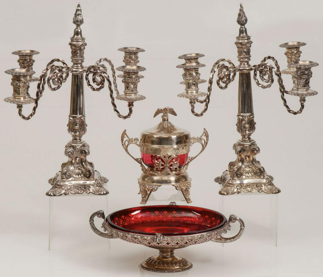 VINTAGE SILVER PLATED TABLEWARES: VINTAGE SILVER PLATED TABLEWARES. Comprising a large and impressive pair of ornate Wilcox silver plated, five light, candelabra, the ornate four footed base supporting a tapering fluted column with tw
