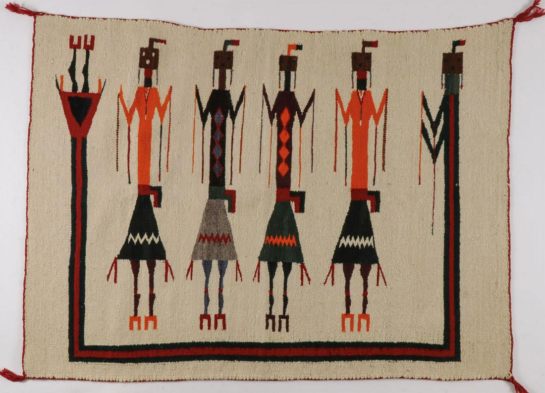 A NAVAJO YEI RUG: A NAVAJO YEI RUG. Of traditional form and composition, 48 inches x 34 inches. SHIPPING NOTICE: Jackson's is your sole and only source for one stop packing and shipping. With over 50 years
