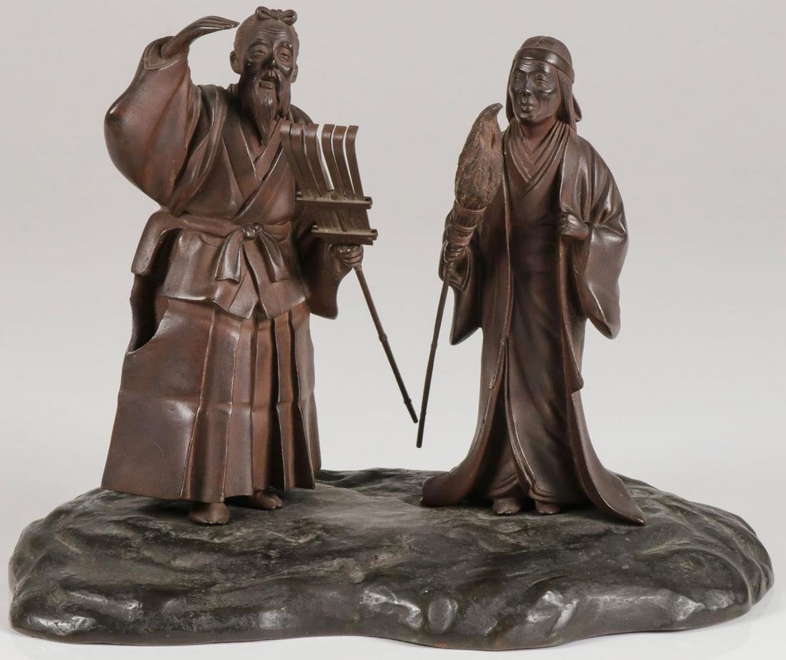 JAPANESE BRONZE OKIMONO MEIJI: JAPANESE BRONZE OKIMONO MEIJI. Comprising a very finely sculpted bronze with brown and black patina okimono depicting two standing figures each holding implements and resting atop a sculpted earthen m