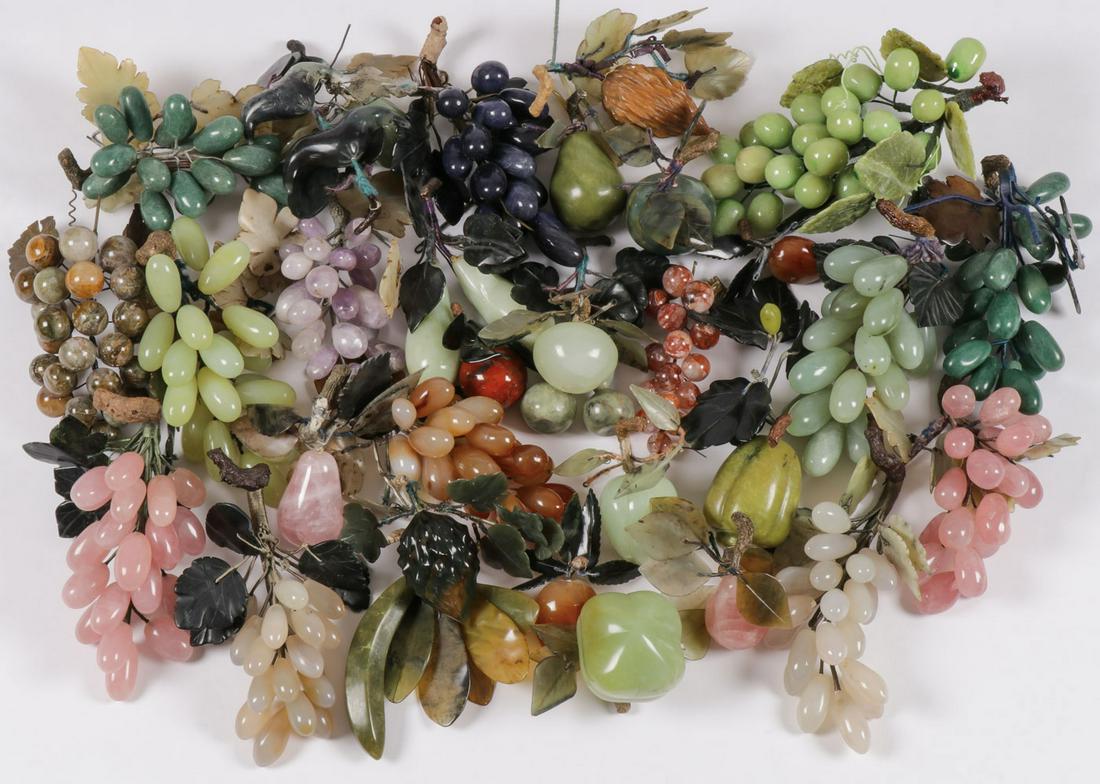 CHINESE HARDSTONE FRUIT: CHINESE HARDSTONE FRUIT. Comprising a good group of hardstone fruits depicting various forms and species such as plantains, grapes, apples, cherries, and plums. Rendered from a variety of hardstone in
