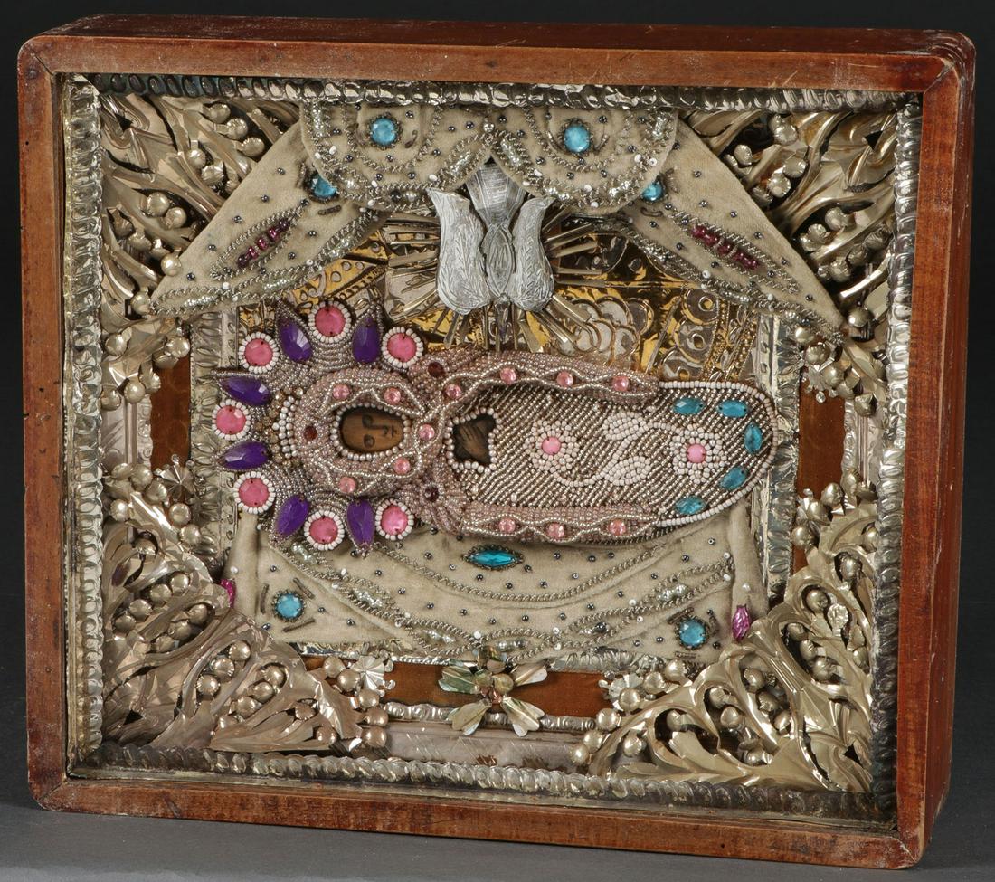 A RUSSIAN ICON OF THE DORMITION, 19TH C: A RUSSIAN ICON OF THE DORMITION, 19TH C. Contained in its original shadow box frame (kiot), the reposed Virgin overlaid with a profusely beaded riza and halo and the interior comprised of ornate foil 
