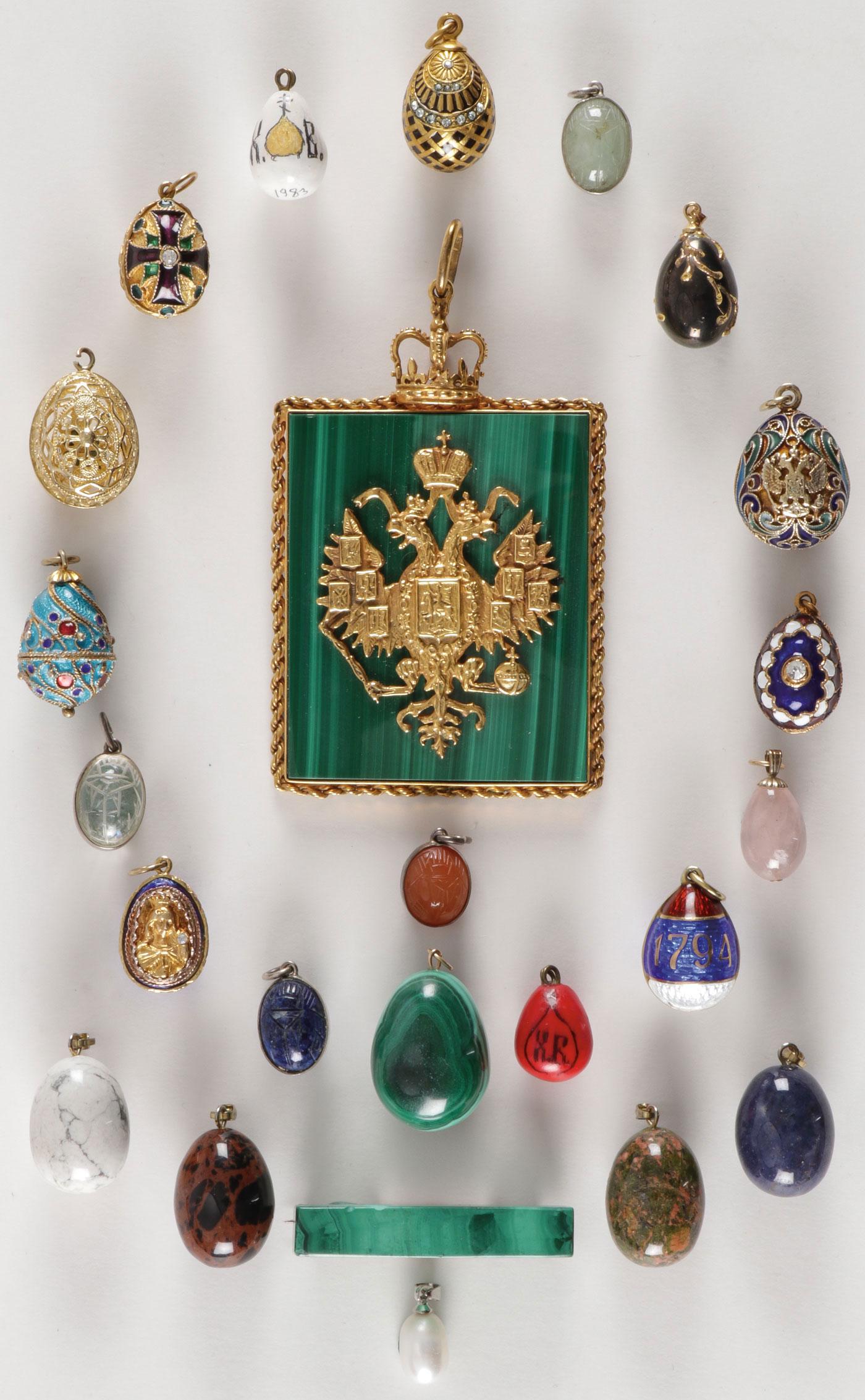 SPECTACULAR 24-PIECE RUSSIAN JEWELRY GROUP: SPECTACULAR 24-PIECE RUSSIAN JEWELRY GROUP. Comprising 24 individual pieces primarily pendant egg forms produced in a wide variety of materials including silver, cloisonné enamel, lapis, malachite, j