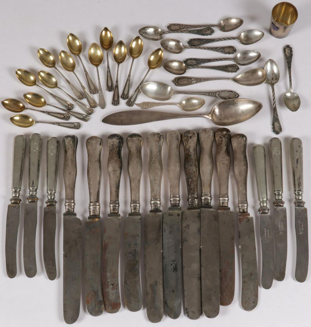 RUSSIAN & OTHER MIXED SILVER: RUSSIAN & OTHER MIXED SILVER. Comprising over 40 pieces of Russian and other countries silver flatware pieces including demitasse spoons, teaspoons, serving spoons, and large dinner knives with silver