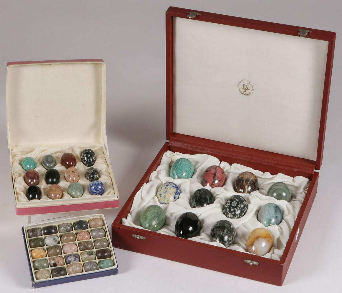 RUSSIAN HARDSTONE SPECIMENS: RUSSIAN HARDSTONE SPECIMENS. Comprising 49 carved and polished hardstone specimens in egg form in three cases. The interior lid of one case with numbered corresponding specimen titles. Largest sized s