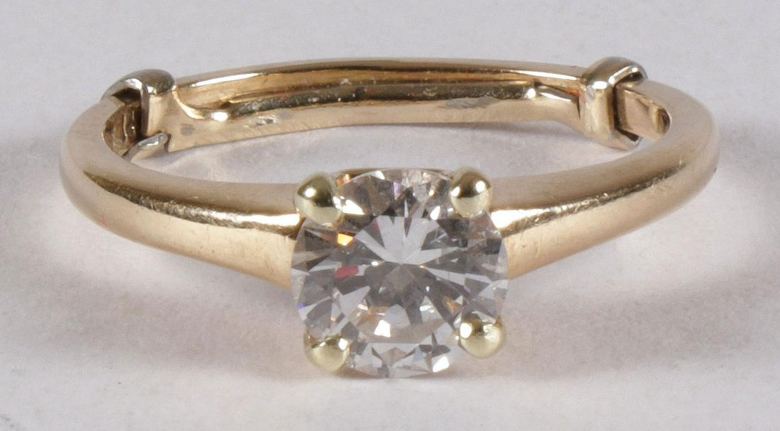 LADIES 14KT GOLD SOLITAIRE DIAMOND RING: LADIES 14KT GOLD SOLITAIRE DIAMOND RING. Containing an approximately one carat round brilliant cut diamond of approximately SI1/2 clarity & approximately H/I color range. Interior of band stamped 14KT
