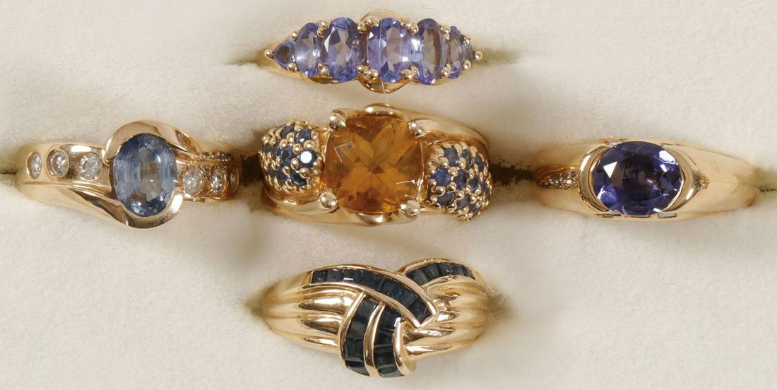 ORNATE LADIES GOLD & GEMSTONE RINGS: ORNATE LADIES GOLD & GEMSTONE RINGS. Comprising five ladies 14 karat gold rings set with various gemstones as shown including citrine, emerald, and tanzanite. Interior of each band stamped 14K. Rangin