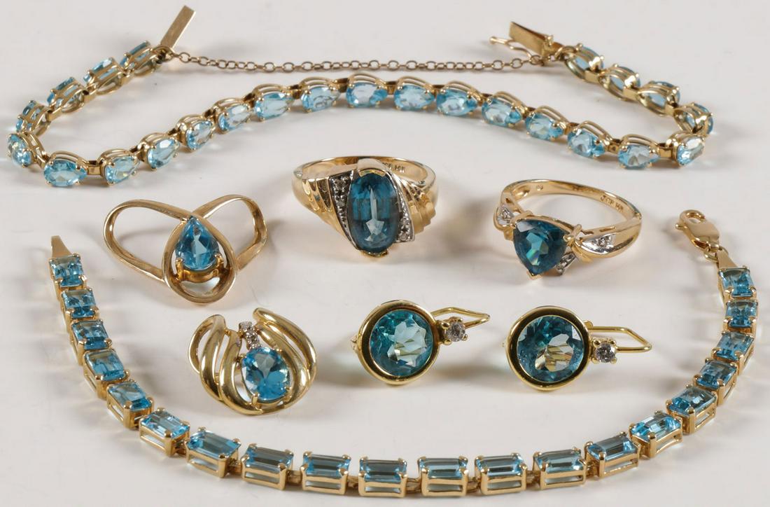 BEAUTIFUL GROUP GOLD & BLUE TOPAZ: BEAUTIFUL GROUP GOLD & BLUE TOPAZ. Comprising a good group of 14 karat gold jewelry, most set with blue topaz, a few examples accented with melee diamonds, including two lovely tennis bracelets, a pen