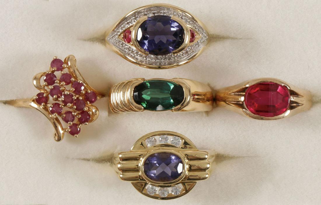 FIVE CHARMING GOLD & GEMSTONE RINGS: FIVE CHARMING GOLD & GEMSTONE RINGS. Comprising five ladies yellow gold rings set with various precious and semi-precious gemstones including ruby, tourmaline, and tanzanite. Two rings in 10kt gold (4
