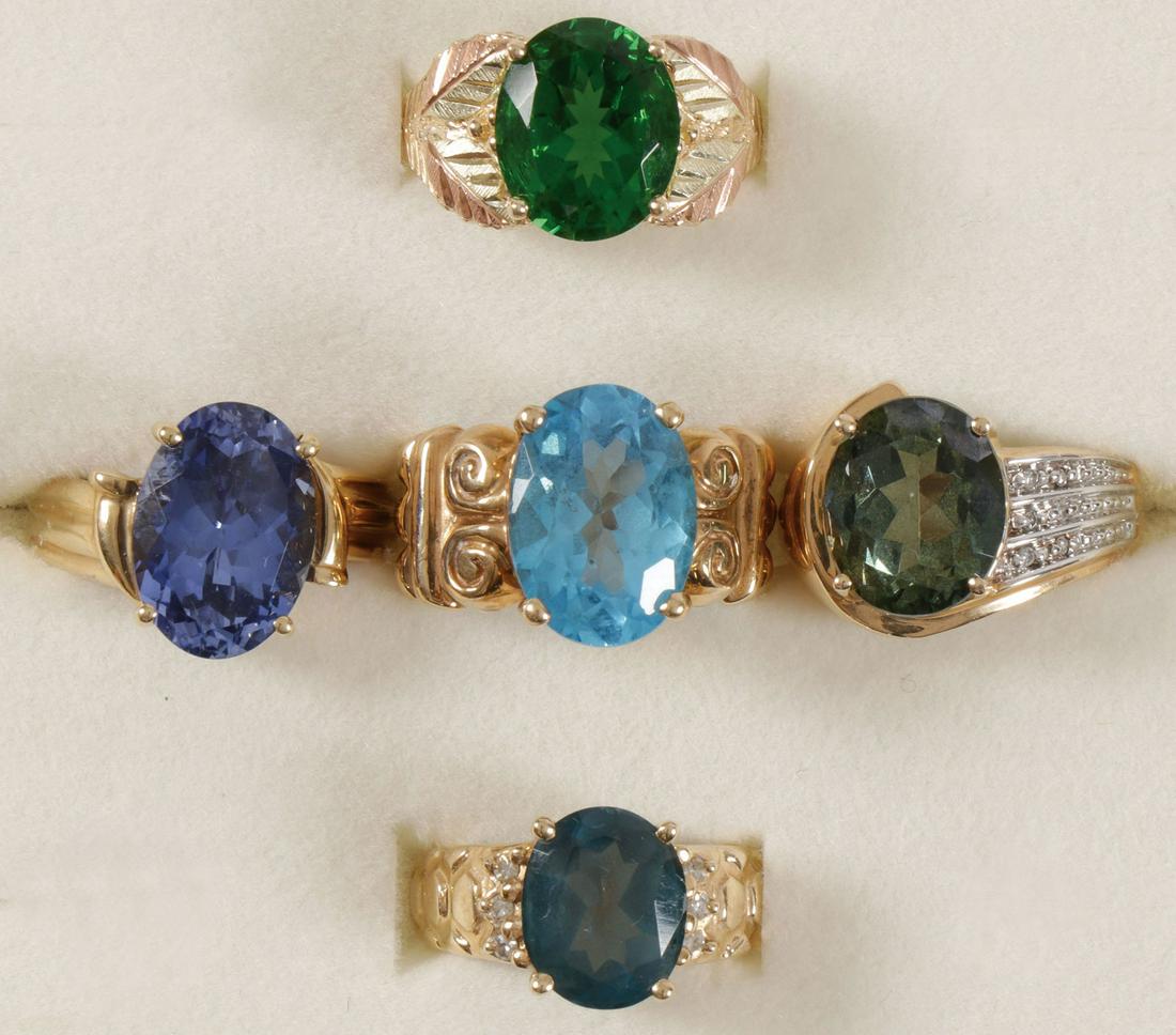 IMPRESSIVE GEMSTONE COCKTAIL RINGS: IMPRESSIVE GEMSTONE COCKTAIL RINGS. Comprising five ladies 10 karat gold cocktail rings each set with various large gemstones as shown including London Blue Topaz, Spinel, Blue Topaz, and Cubic Zircon