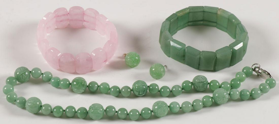 NICE CARVED JADE JEWELRY: NICE CARVED JADE JEWELRY. Comprising a necklace with carved jade beads, length 17 inches, and a pair of matching earrings, together with two carved jade stretch bracelets. SHIPPING NOTICE: