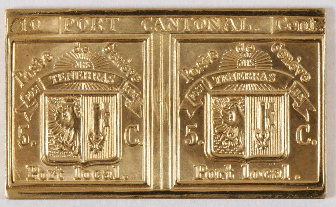 GOLD EMBOSSING OF THE DOUBLE GENEVA STAMP: GOLD EMBOSSING OF THE DOUBLE GENEVA STAMP. Comprising a gold stamp struck in .900 gold depicting the rare Swiss double Geneva stamp. Weight 10 grams. SHIPPING NOTICE: Jackson's is your so