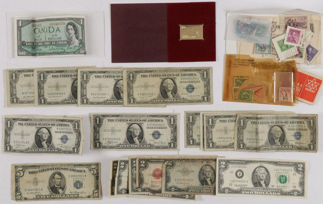A GROUP OF U.S. PAPER MONEY: A GROUP OF U.S. PAPER MONEY. Comprising over 20 U.S. notes including eleven 1935 one dollar bills, five 1957 one dollar bills, and six two dollar bills (dates ranging from 1928-2003). Together with a