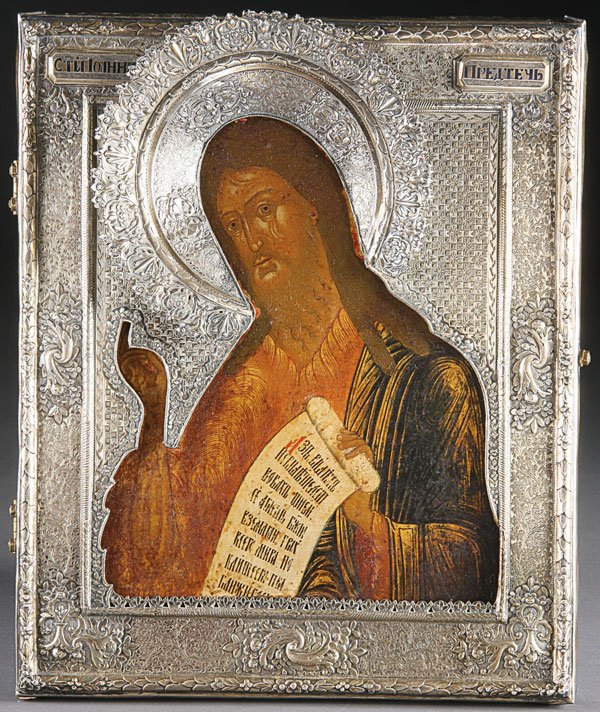 A Russian Icon: St. John the Forerunner: A RUSSIAN ICON: St. John the Forerunner, circa 1825. John delivers a blessing of the type favored by the Old Believers and holds a scroll with text adapted from John 1:29 'I saw and witnessed concerni