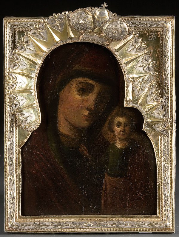A Russian Icon: The Kazan Mother of God: A RUSSIAN ICON: The Kazan Mother of God, circa 1800. Overlaid with an elaborate silver-gilt repousse and chased riza with ornate applied halo. 15.25 inches x 12 inches (39 x 30.5 cm). Estimate $1500-$